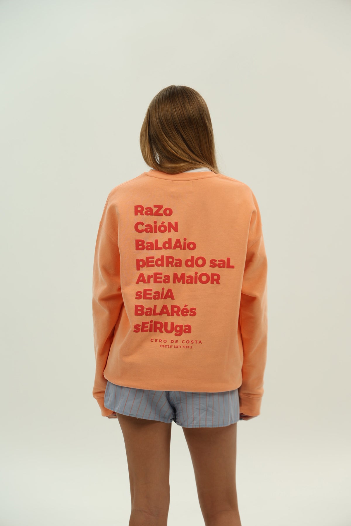 SUDADERA MELOCOTÓN/ROJO "PLAYAS RAZO"