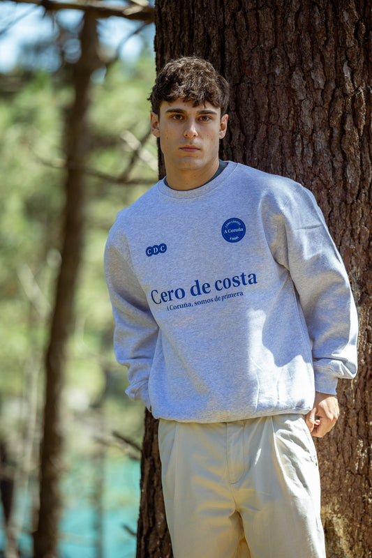 SUDADERA GRIS/AZUL "SOMOS DE PRIMERA"