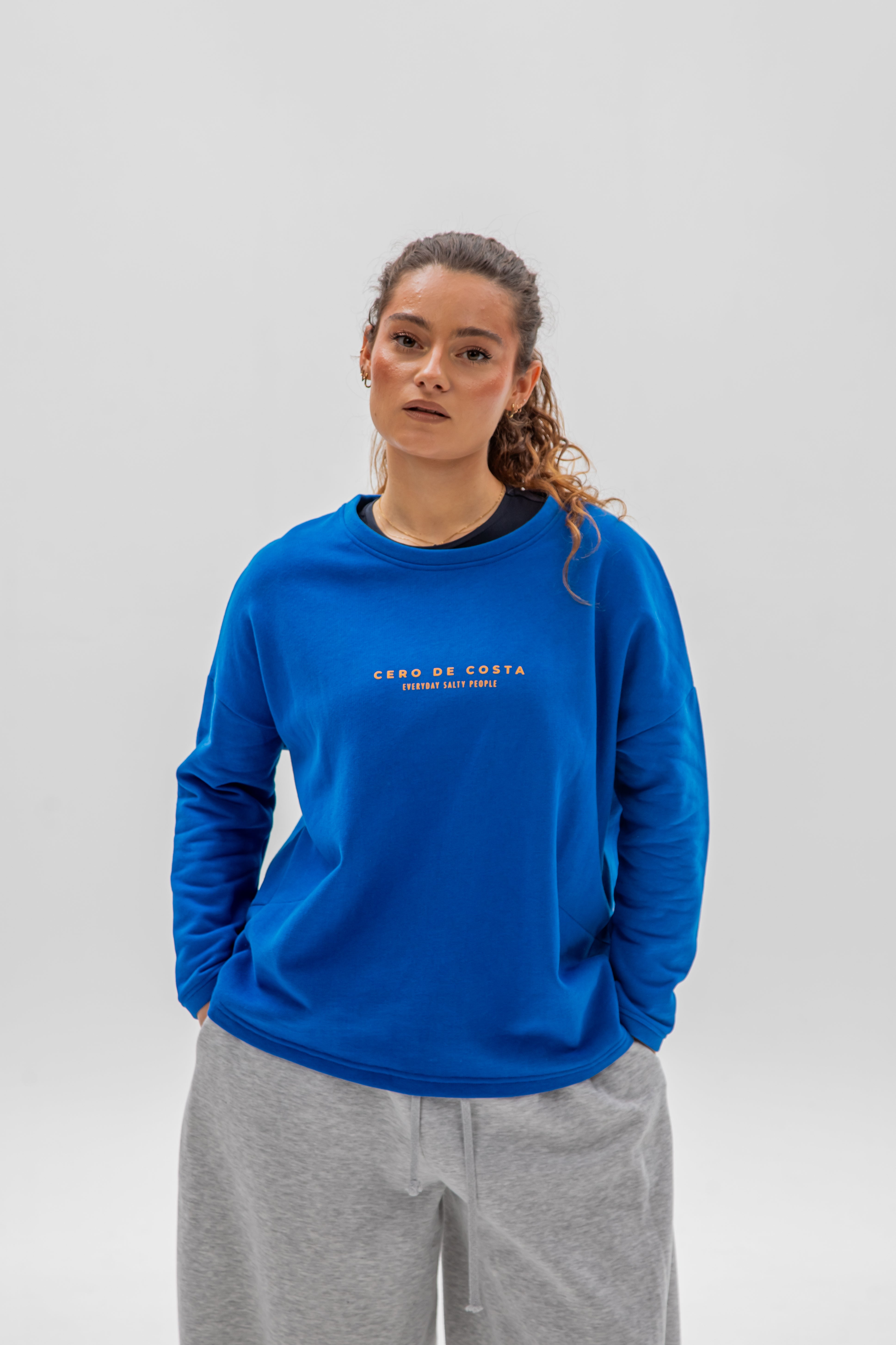 SUDADERA CERO DE COSTA SIN CENEFA AZUL/NARANJA PLAYAS SURF