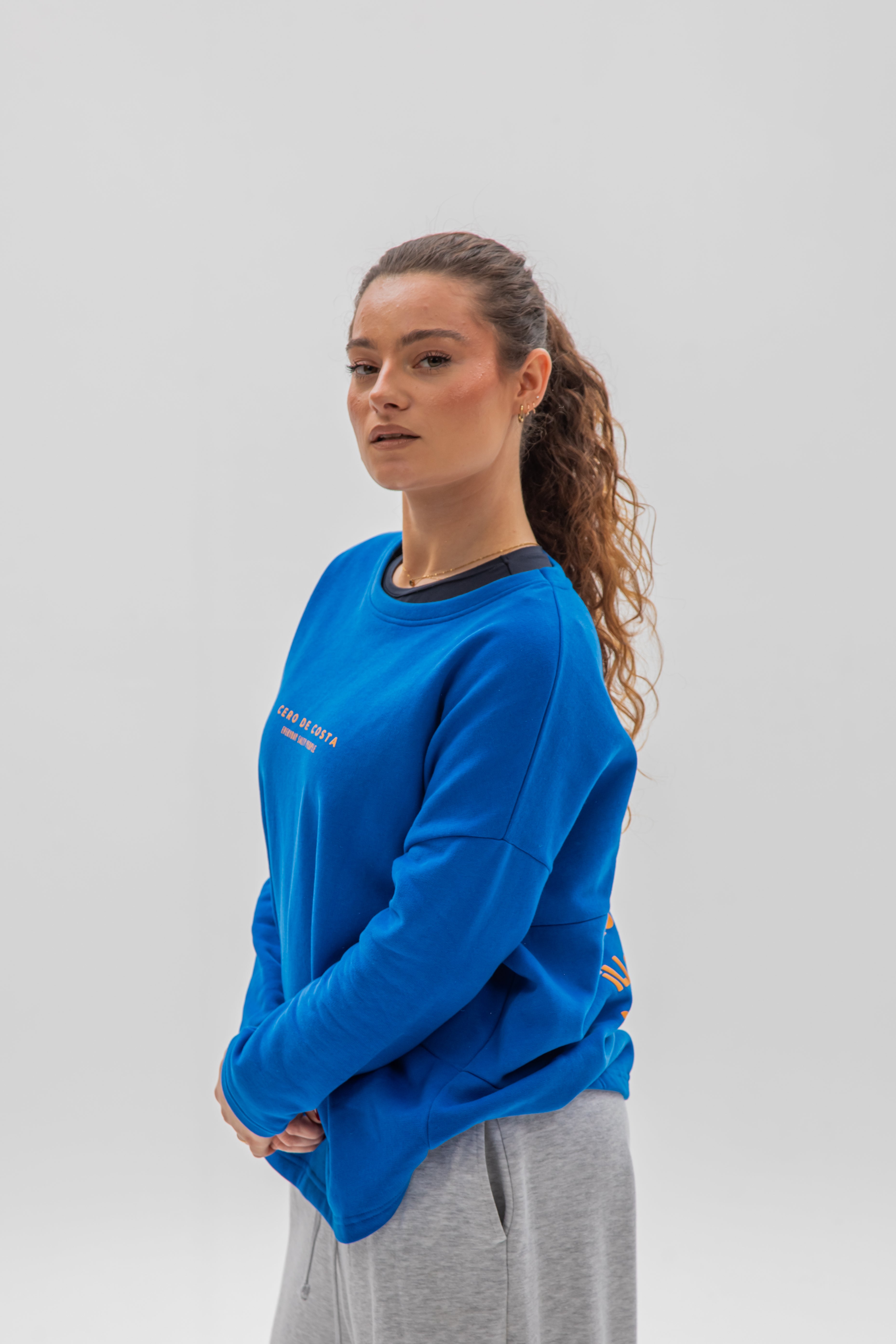 SUDADERA CERO DE COSTA SIN CENEFA AZUL/NARANJA PLAYAS SURF