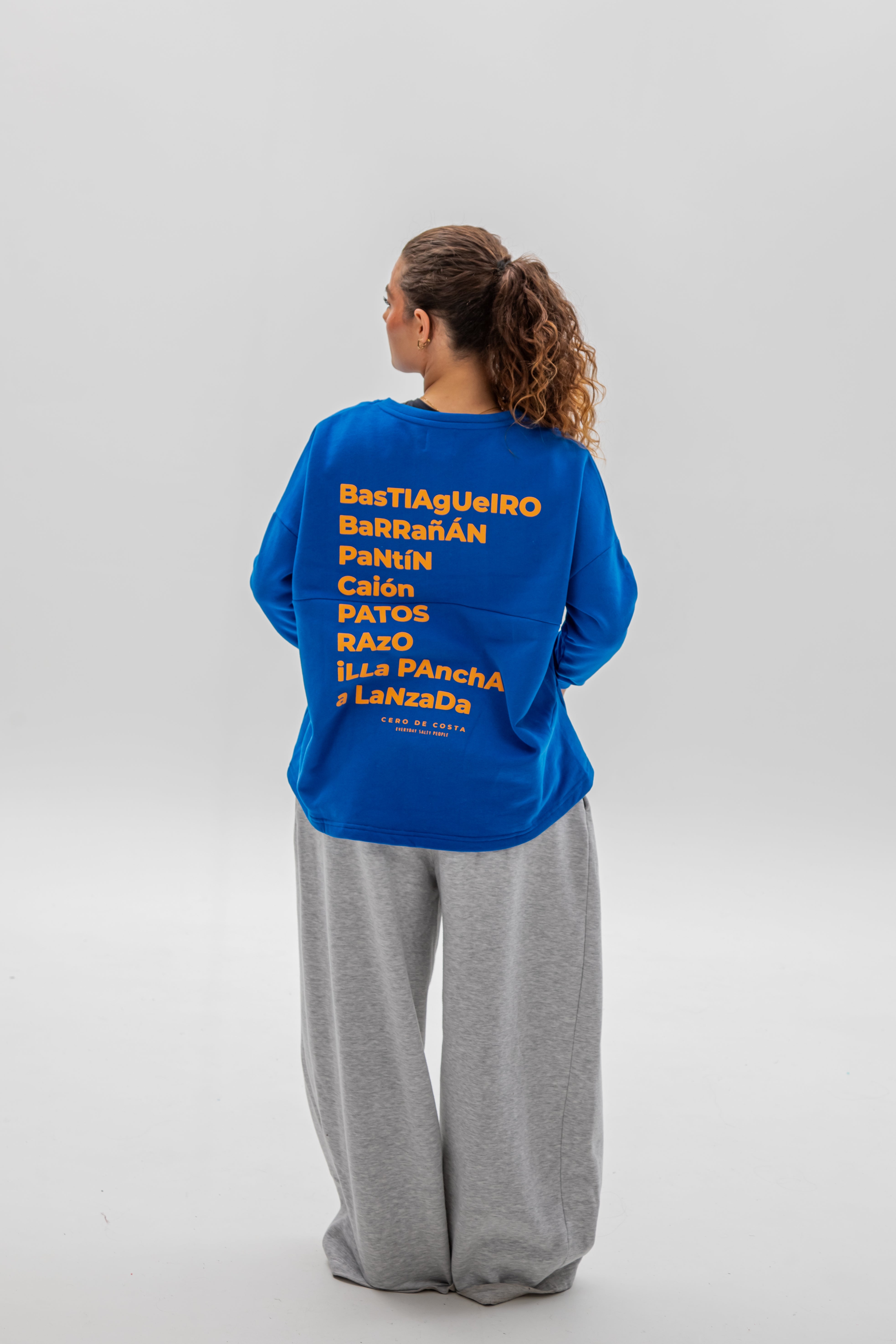 SUDADERA CERO DE COSTA SIN CENEFA AZUL/NARANJA PLAYAS SURF