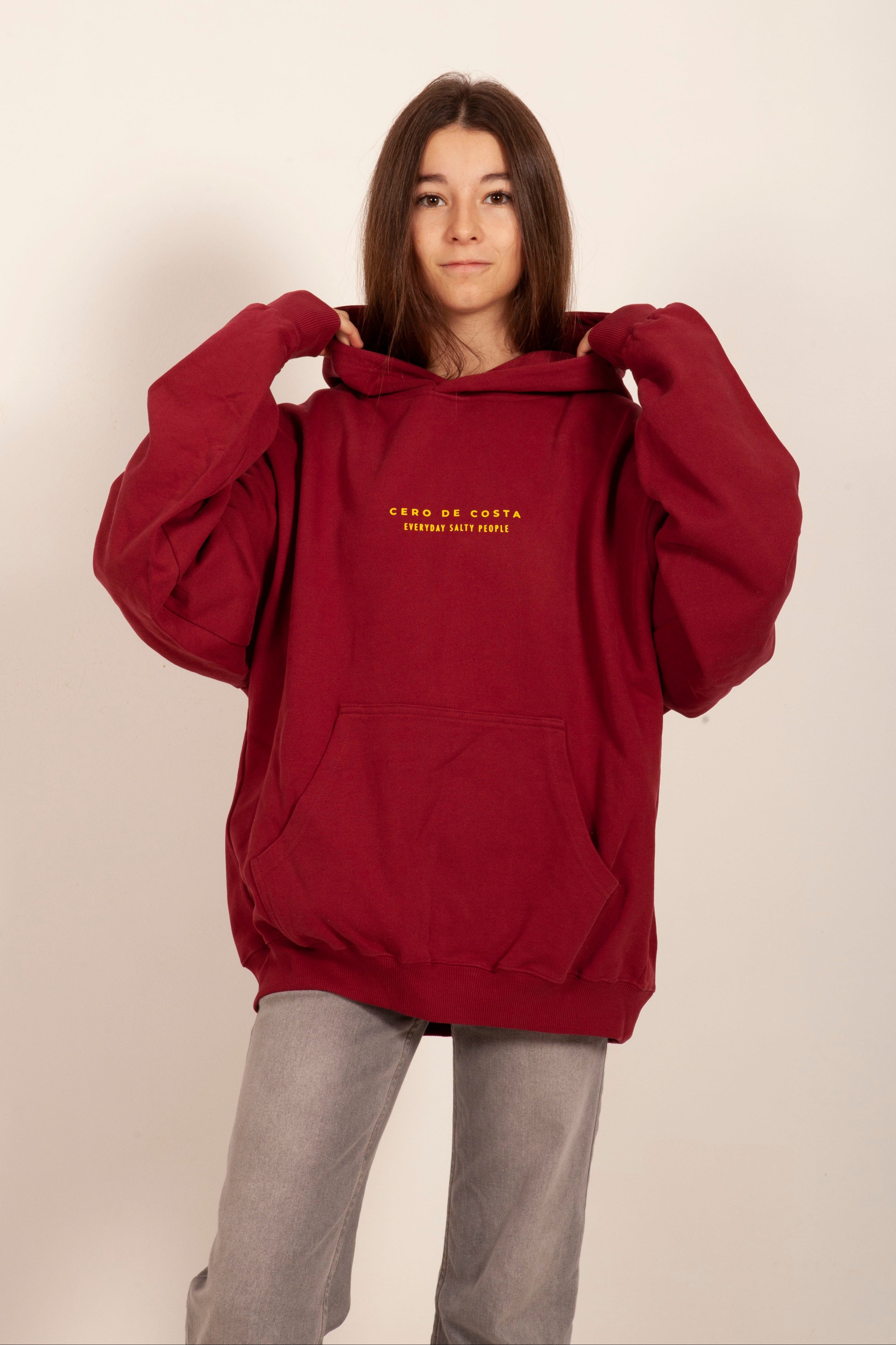 SUDADERA GRANATE ROJO/AMARILLO “CERO DE COSTA” PLAYAS SURF CON CAPUCHA